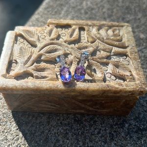 This is a perfect pair of purple earrings. Beautiful and unused!